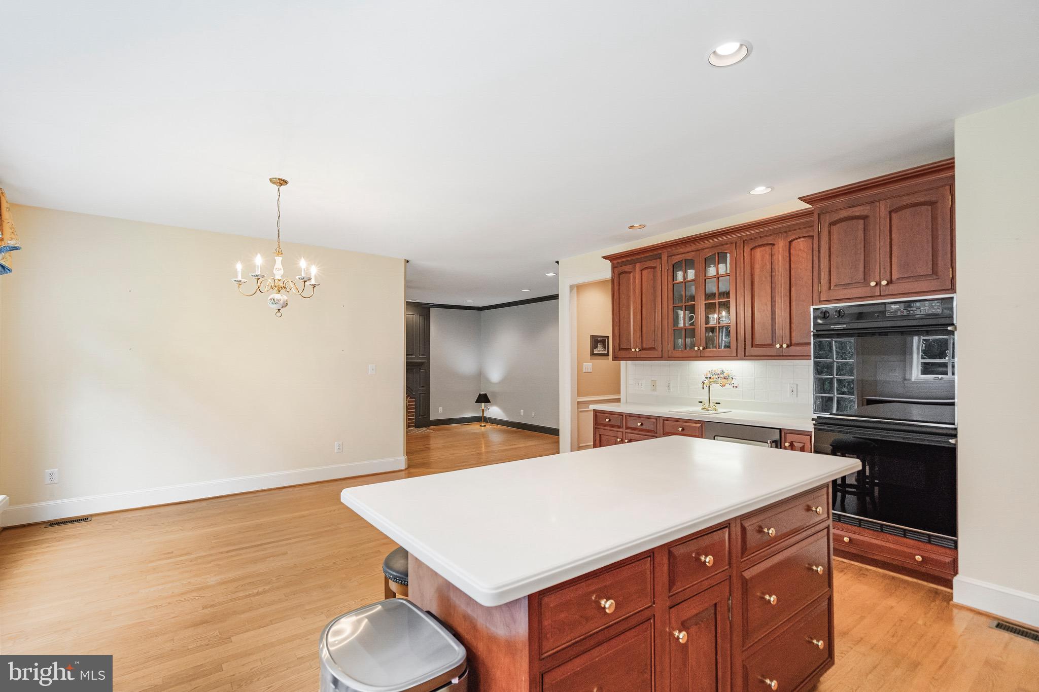 965 St Stephens Church Road Gambrills, MD 21054 - Photo 14 of 43 a kitchen with a sink cabinets and wooden floor