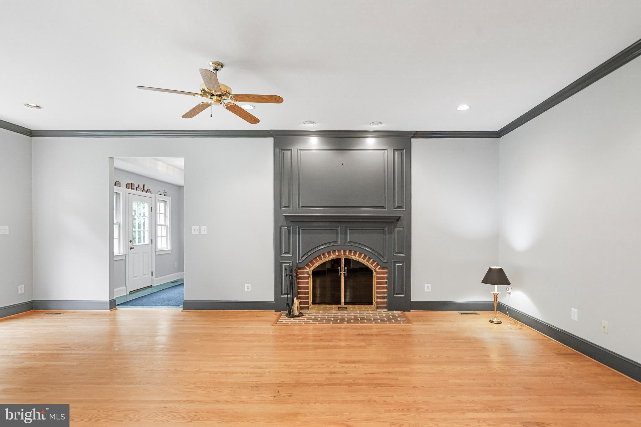 965 St Stephens Church Road Gambrills, MD 21054 - Photo 15 of 43 a view of empty room with wooden floor and fan