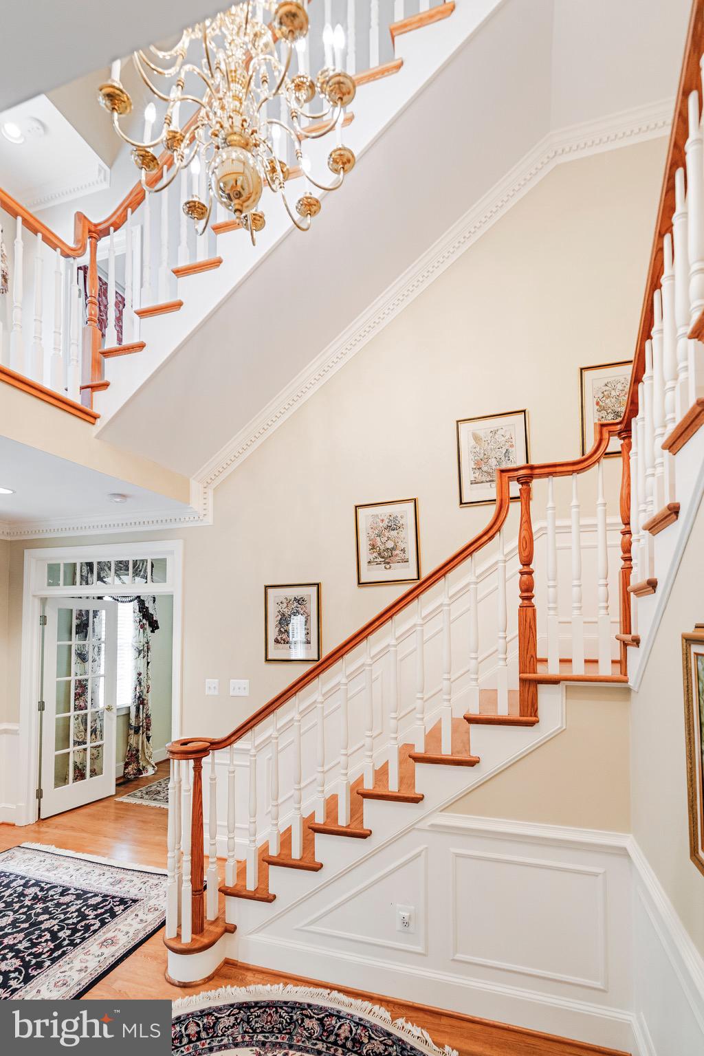965 St Stephens Church Road Gambrills, MD 21054 - Photo 19 of 43 a view of staircase with lots of frames on wall and windows