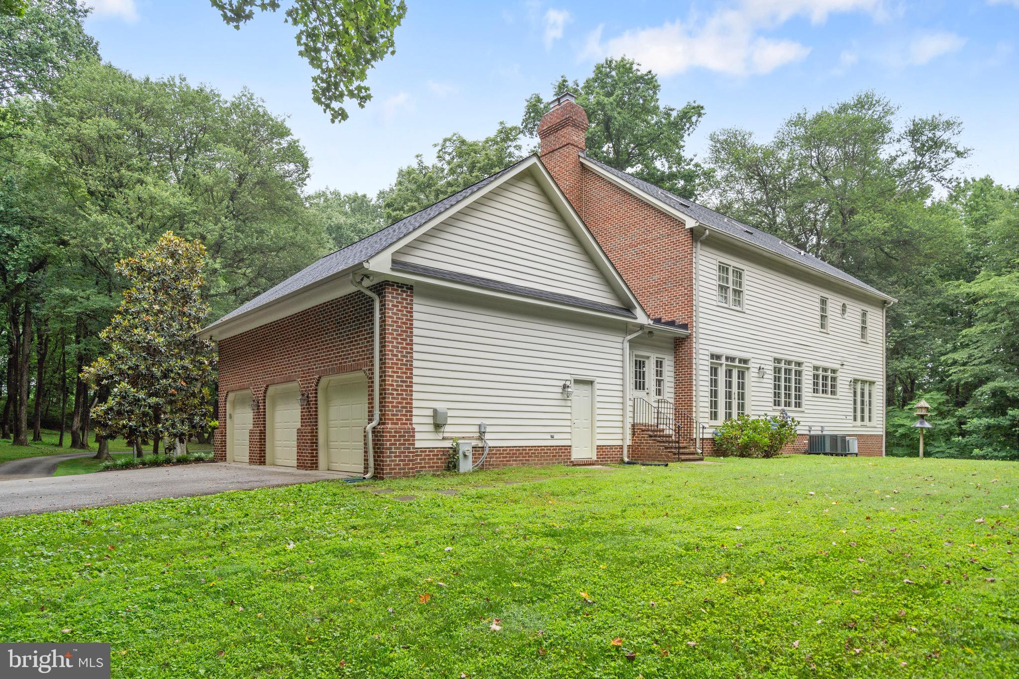965 St Stephens Church Road Gambrills, MD 21054 - Photo 2 of 43 a view of a house with backyard and garden