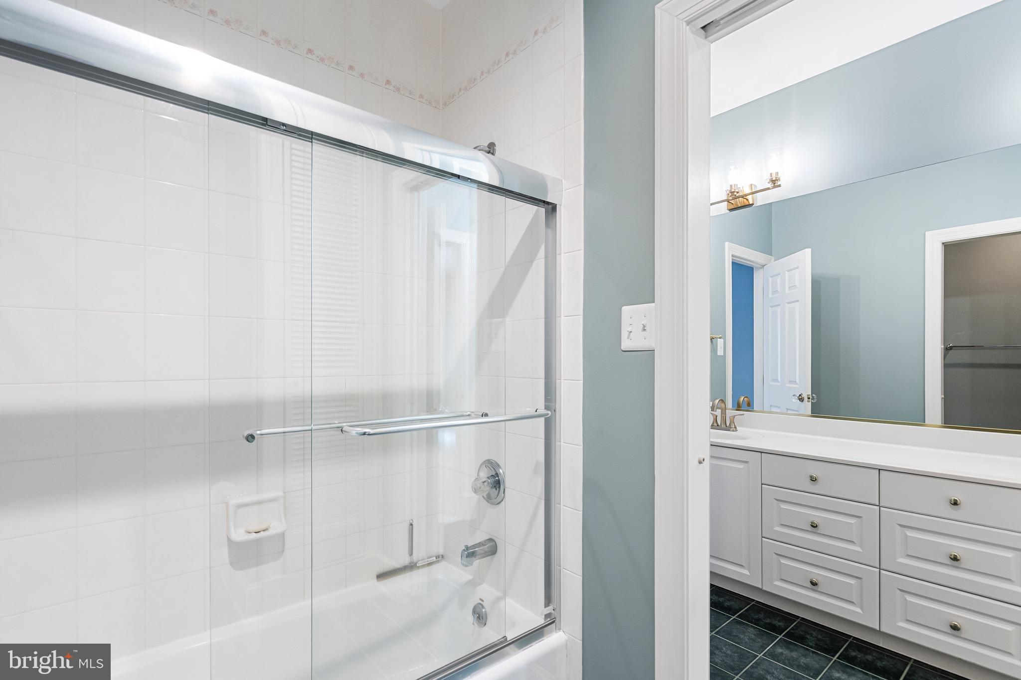 965 St Stephens Church Road Gambrills, MD 21054 - Photo 26 of 43 a bathroom with a shower and a sink