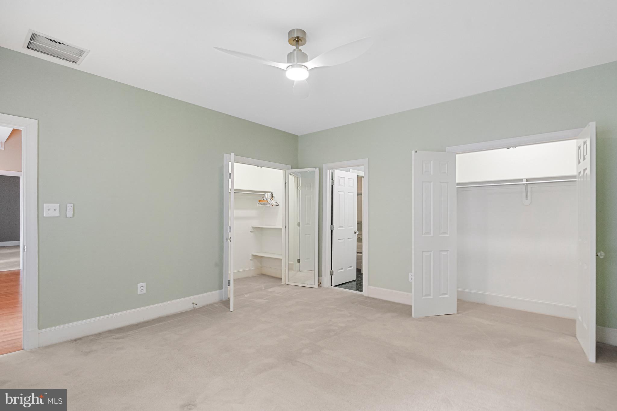 965 St Stephens Church Road Gambrills, MD 21054 - Photo 27 of 43 a view of a room with a ceiling fan and a window