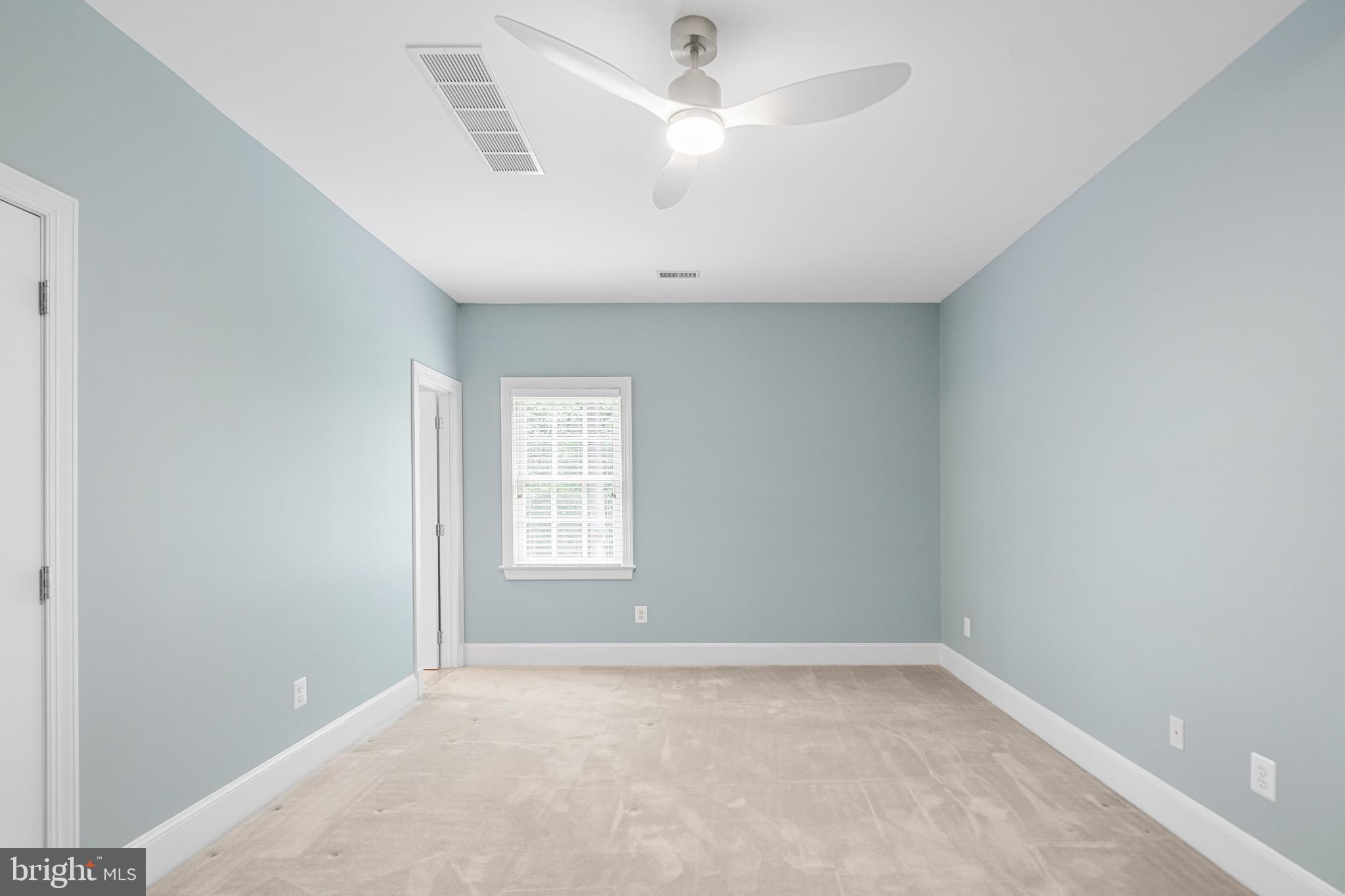 965 St Stephens Church Road Gambrills, MD 21054 - Photo 29 of 43 an empty room with a window and ceiling fan
