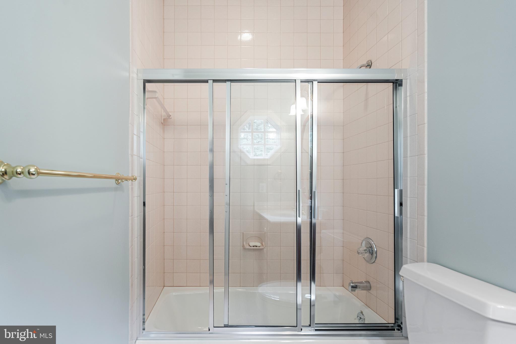 965 St Stephens Church Road Gambrills, MD 21054 - Photo 31 of 43 a bathroom with a glass shower door