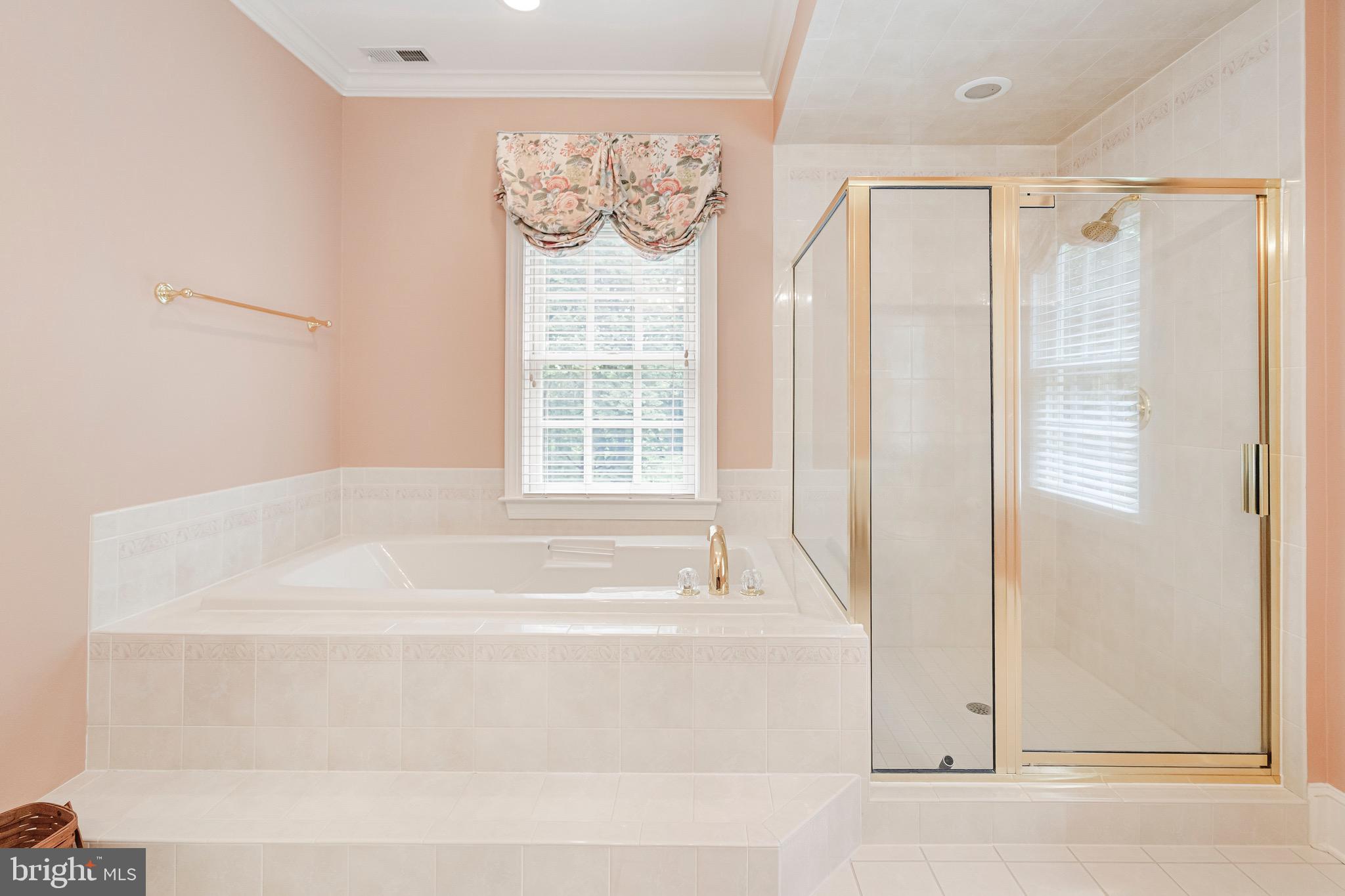 965 St Stephens Church Road Gambrills, MD 21054 - Photo 35 of 43 a bathroom with bathtub and window