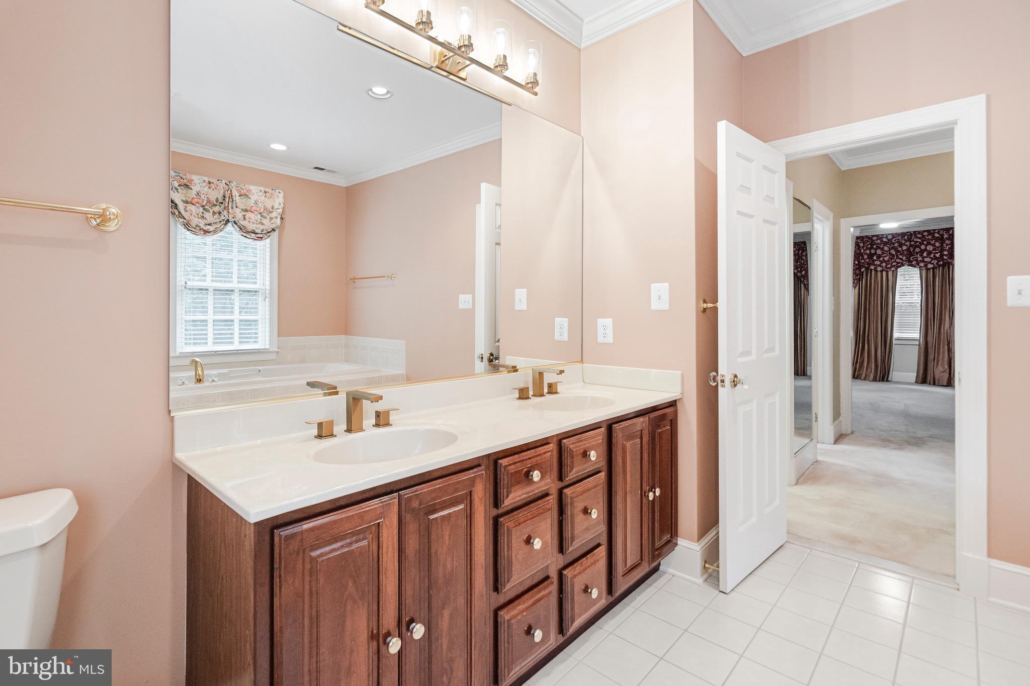 965 St Stephens Church Road Gambrills, MD 21054 - Photo 36 of 43 a bathroom with a sink double vanity and a mirror