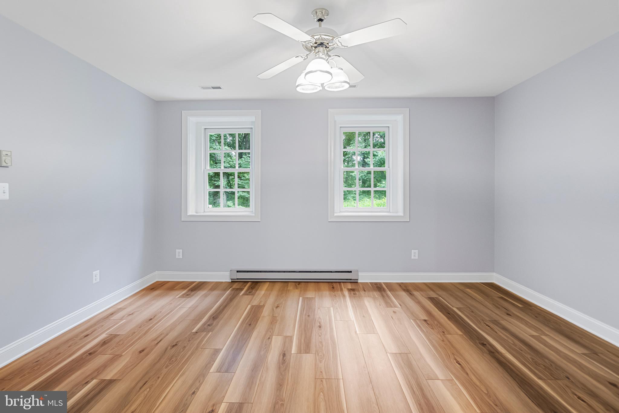 965 St Stephens Church Road Gambrills, MD 21054 - Photo 37 of 43 wooden floor in an empty room with a window