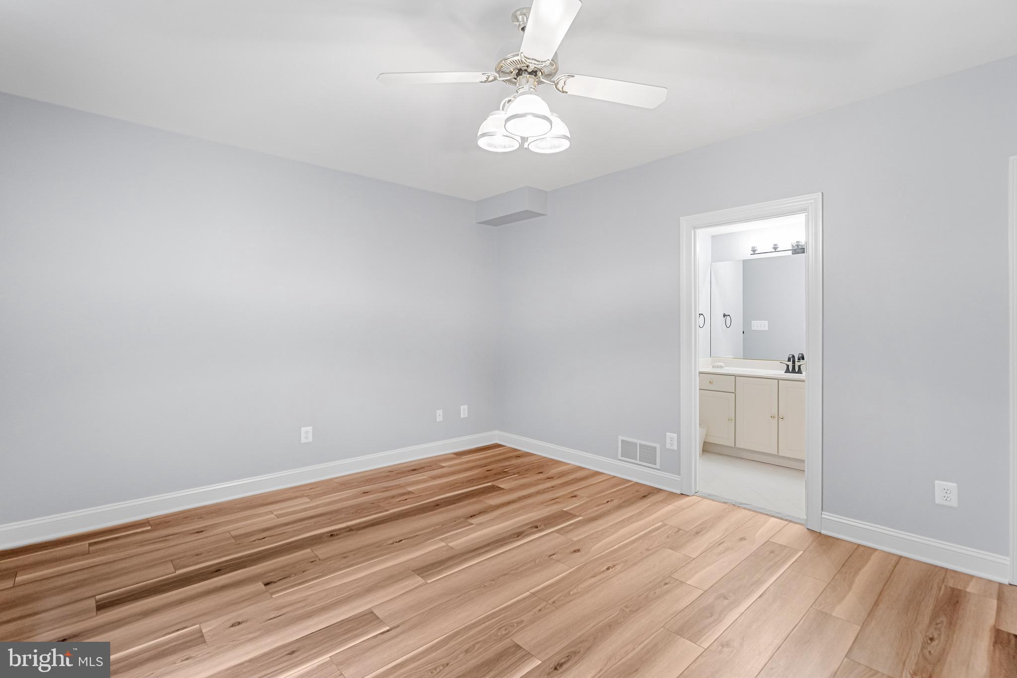 965 St Stephens Church Road Gambrills, MD 21054 - Photo 38 of 43 wooden floor in an empty room with a window