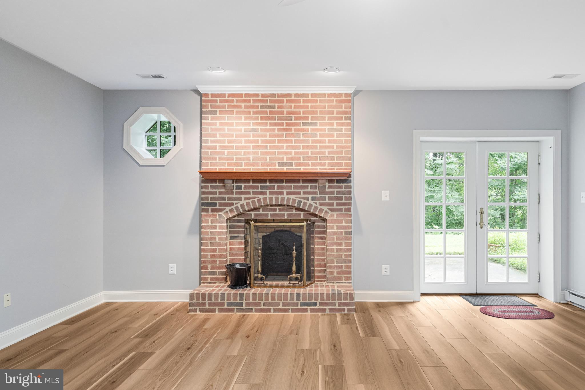 965 St Stephens Church Road Gambrills, MD 21054 - Photo 42 of 43 a view of an empty room with a window and wooden floor