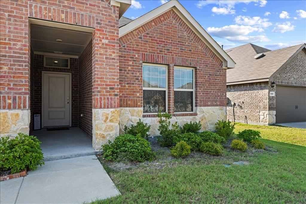 217 Redbarn Lane Caddo Mills, TX 75135 - Photo 1 of 17 a front view of a house with garden