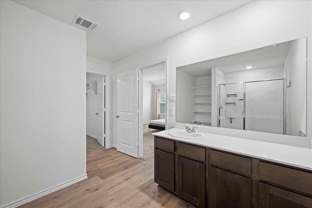 217 Redbarn Lane Caddo Mills, TX 75135 - Photo 12 of 17 a bathroom with a granite countertop sink mirror and double