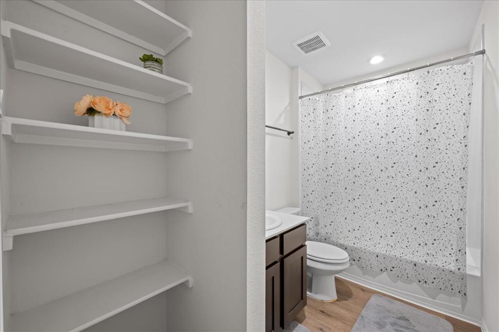 217 Redbarn Lane Caddo Mills, TX 75135 - Photo 4 of 17 a bathroom with a toilet and a shower