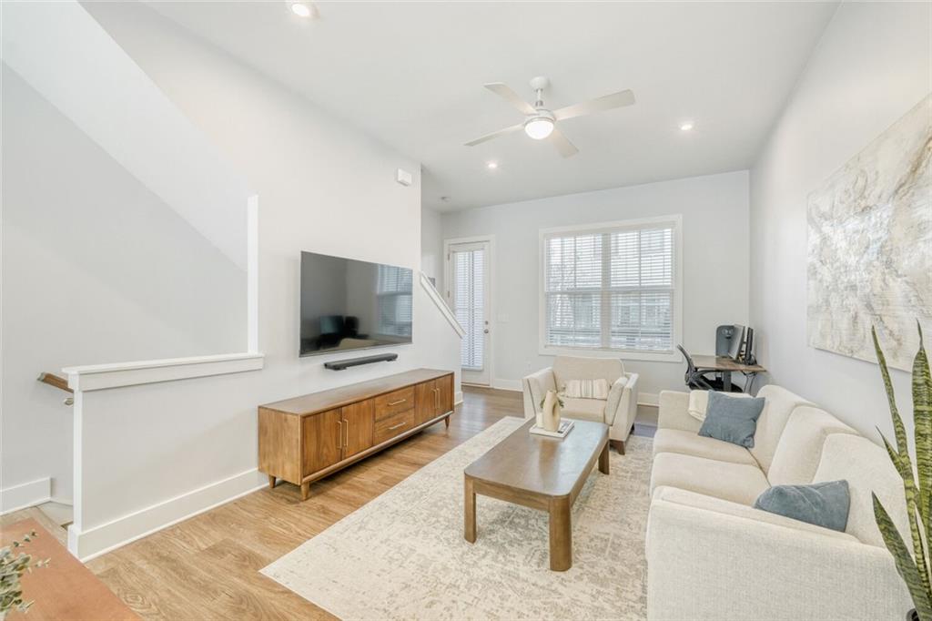 4471 Dandelion Lane Atlanta, GA 30342 - Photo 11 of 30 a living room with furniture and a flat screen tv