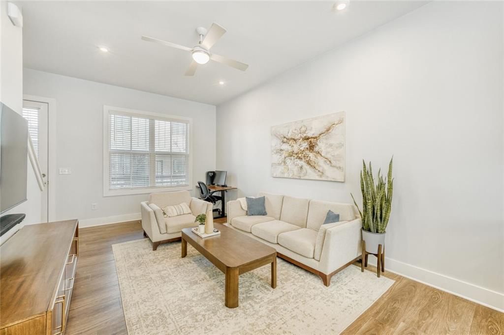 4471 Dandelion Lane Atlanta, GA 30342 - Photo 12 of 30 a living room with furniture and a large window