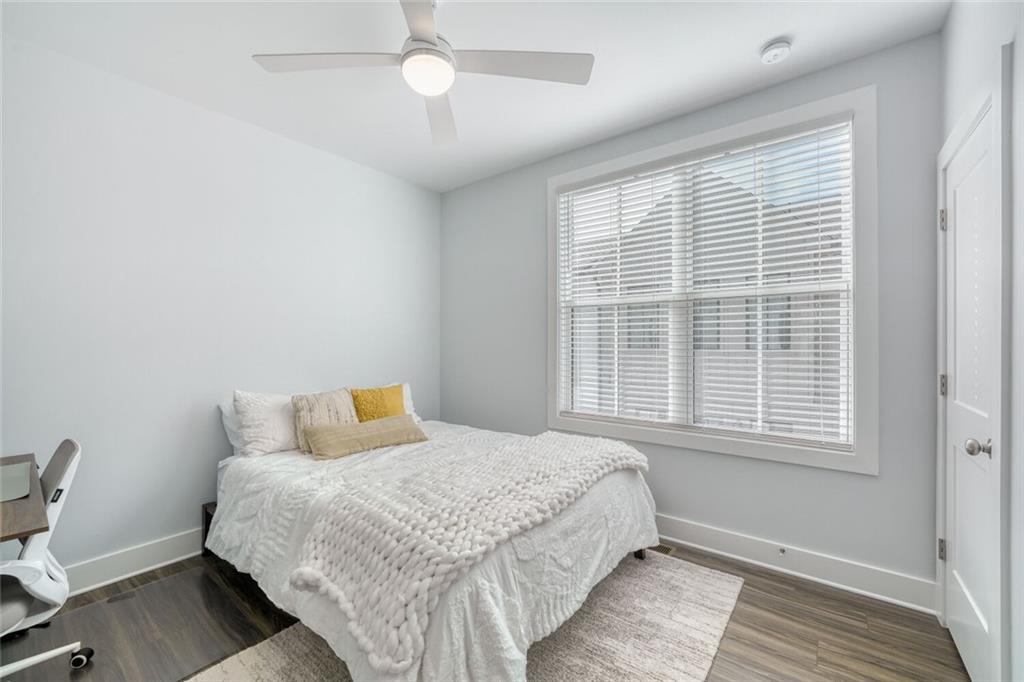 4471 Dandelion Lane Atlanta, GA 30342 - Photo 17 of 30 a bedroom with a bed and a window