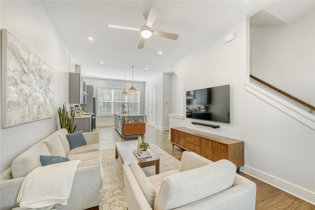 4471 Dandelion Lane Atlanta, GA 30342 - Photo 10 of 30 a living room with furniture and a flat screen tv