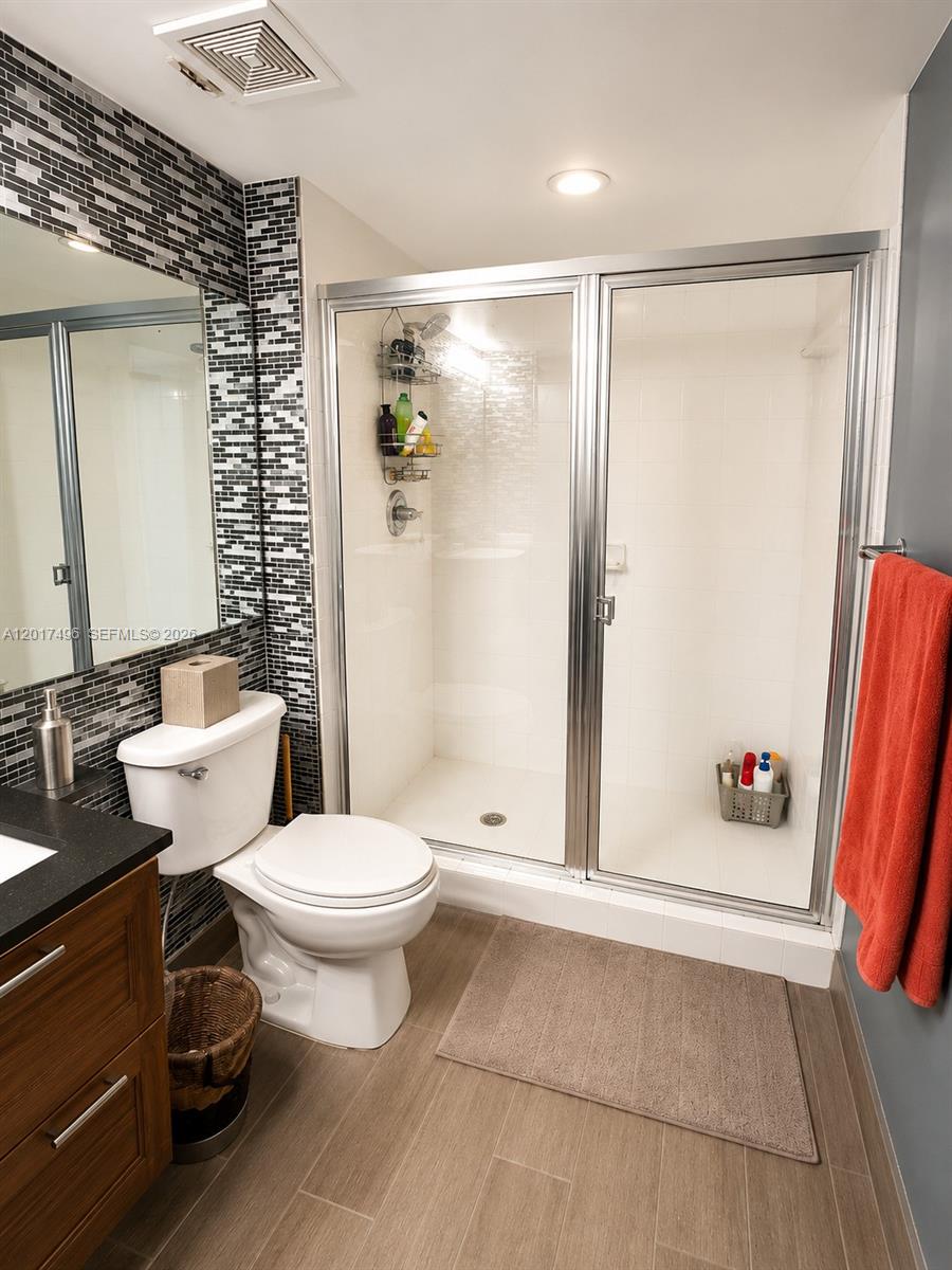Brickell Miami, FL 33131 - Photo 13 of 19 a bathroom with a sink toilet and shower