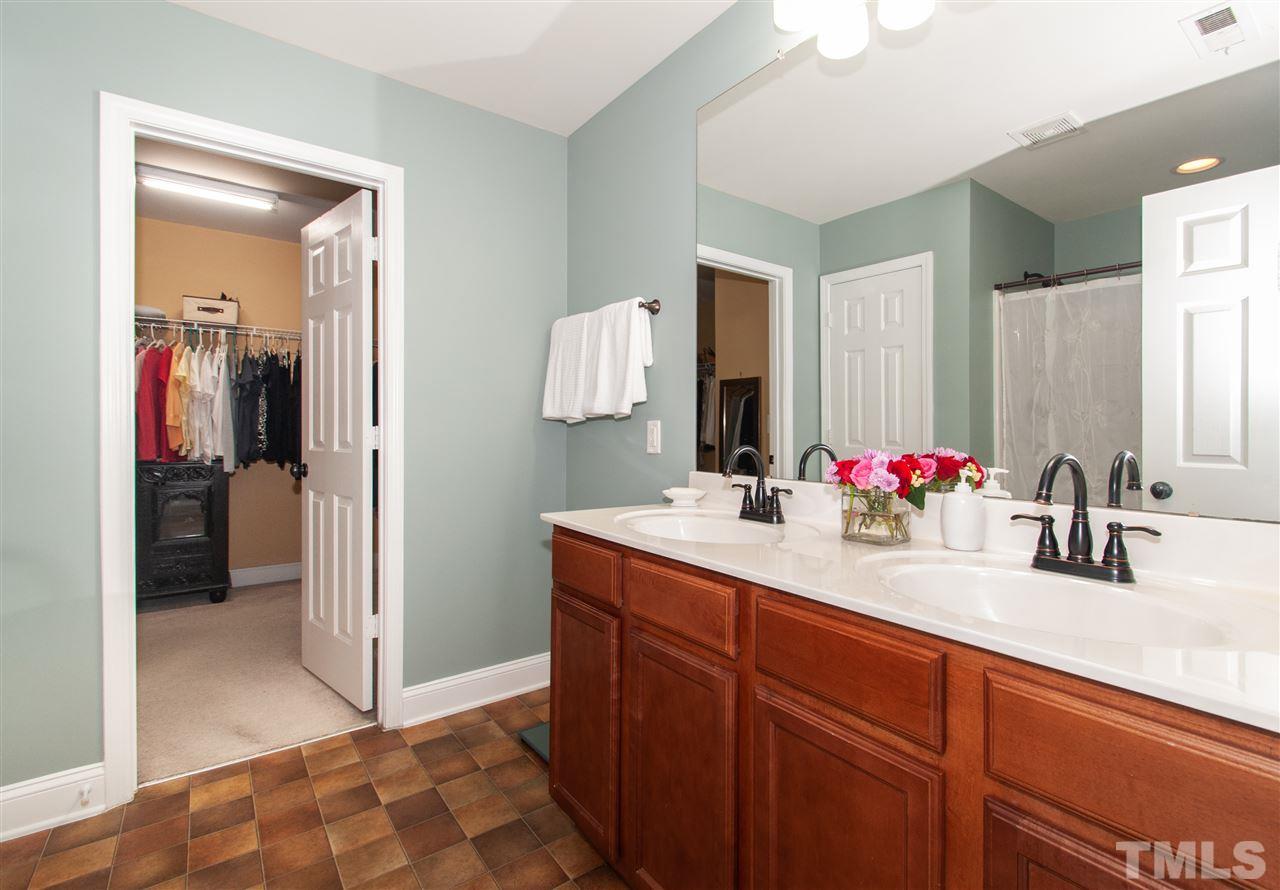5802 Sea Fox Court Raleigh, NC 27616 - Photo 14 of 30 a bathroom with a sink and a mirror