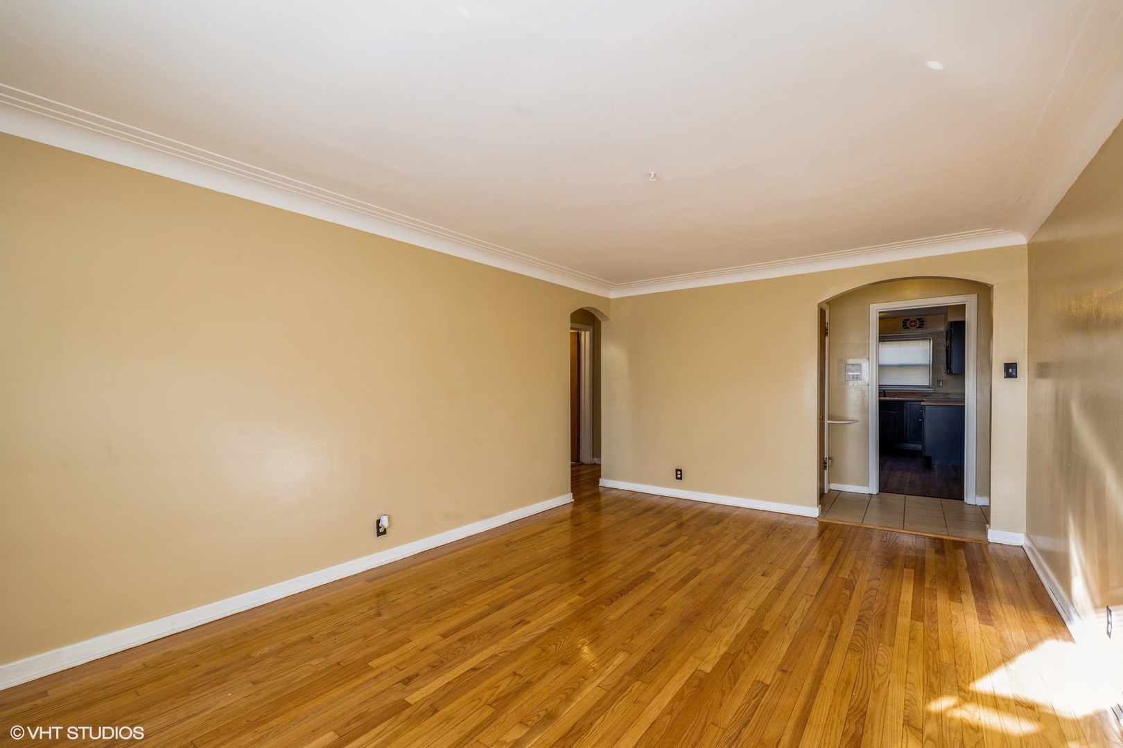 1906 West 80th Street, Unit 1W Chicago, IL 60620 - Photo 2 of 12 a view of an empty room with wooden floor