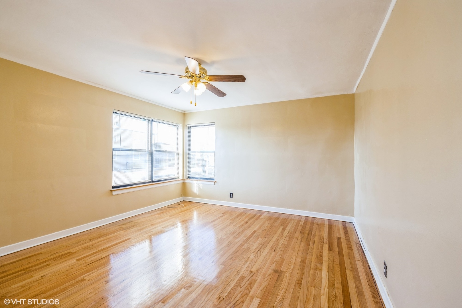 1906 West 80th Street, Unit 1W Chicago, IL 60620 - Photo 9 of 12 a view of an empty room with wooden floor and a window