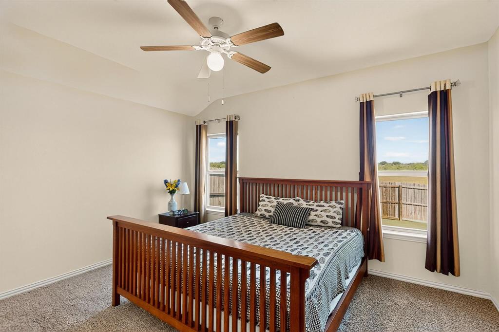 9144 St Barts Road Fort Worth, TX 76123 - Photo 18 of 36 Carpeted bedroom with lofted ceiling and ceiling fan