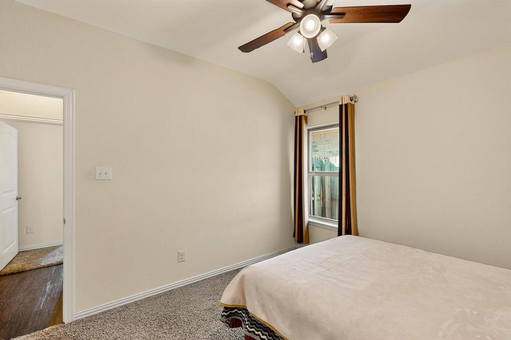 9144 St Barts Road Fort Worth, TX 76123 - Photo 29 of 36 Carpeted bedroom featuring vaulted ceiling and ceiling fan