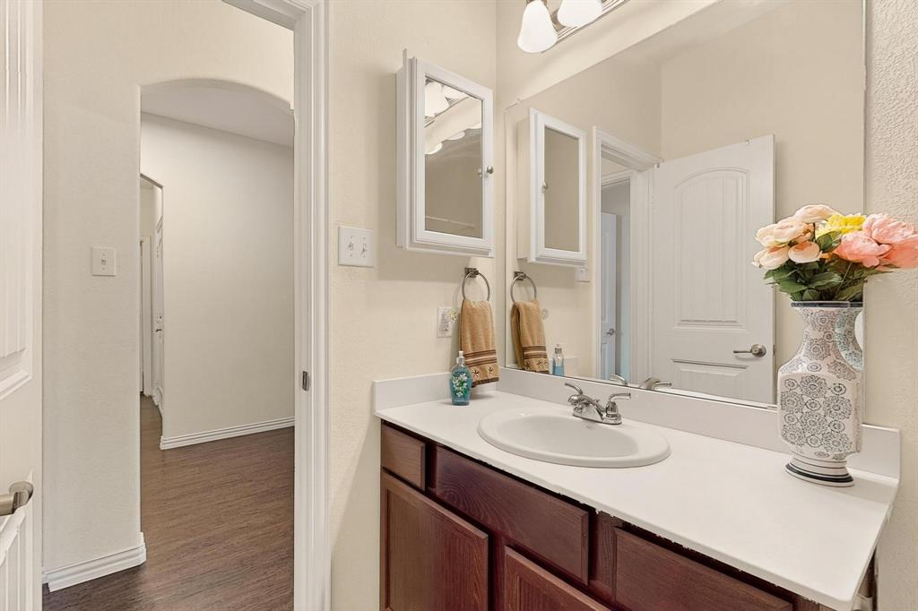 9144 St Barts Road Fort Worth, TX 76123 - Photo 31 of 36 Bathroom with vanity and dark wood finished floors