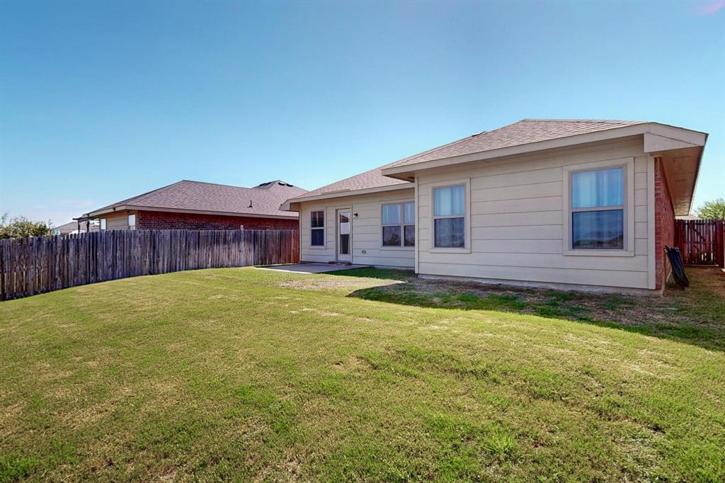 9144 St Barts Road Fort Worth, TX 76123 - Photo 35 of 36 Back of house featuring a fenced backyard, a patio, and roof with shingles