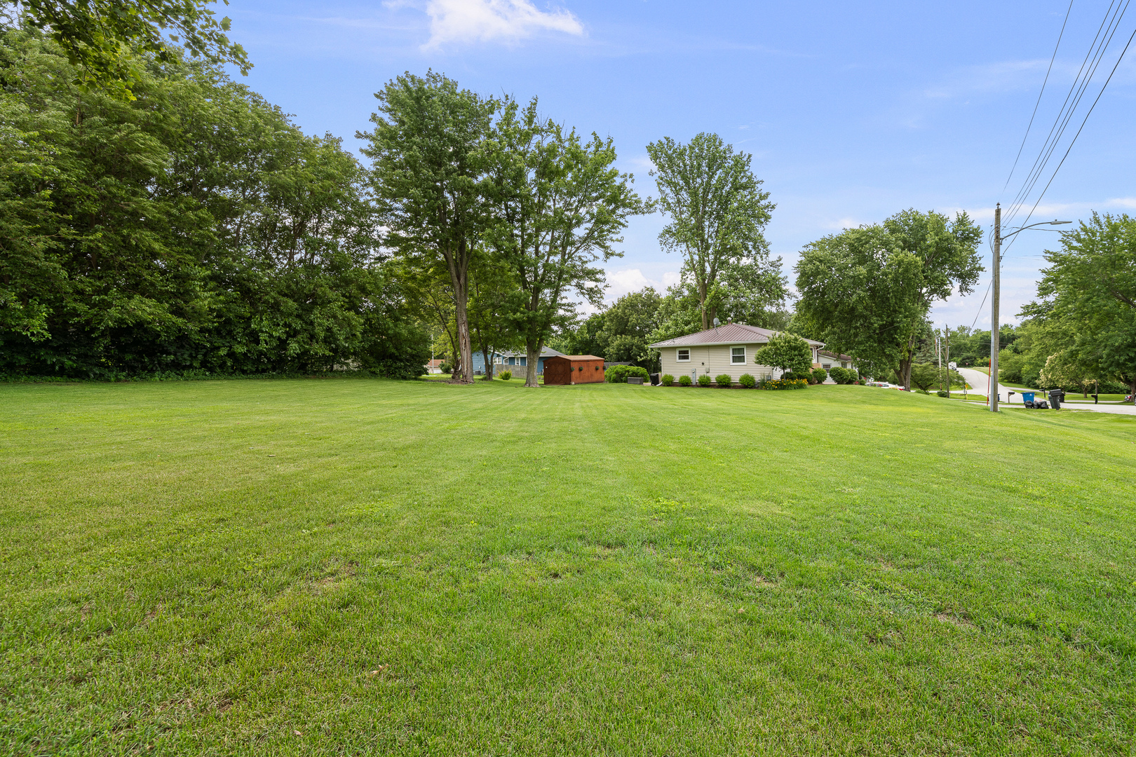 506 Bush Street Reynolds, IL 61279 - Photo 34 of 37 a view of a field of grass and trees