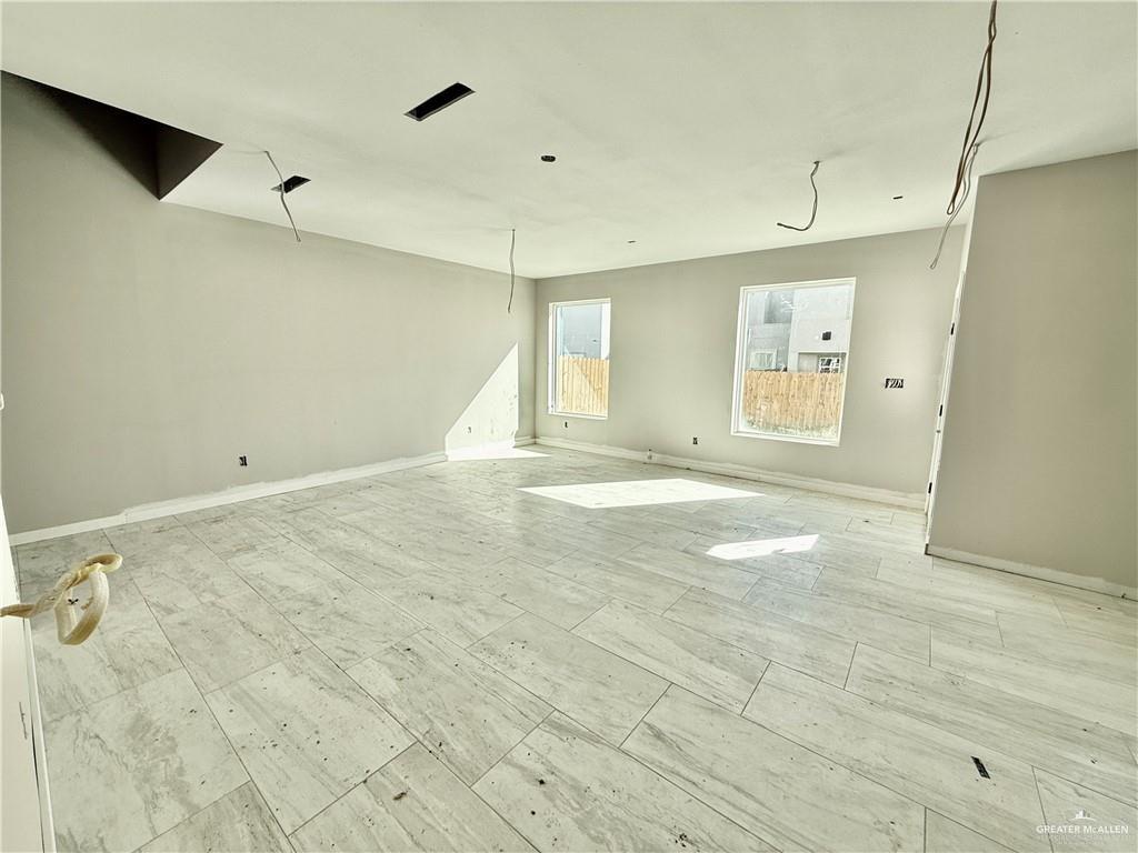 2206 Corales Street Mission, TX 78573 - Photo 6 of 17 a view of an empty room with a window