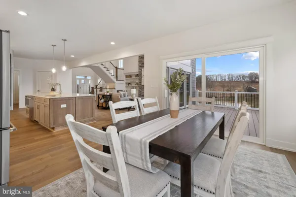 a view of a balcony with a floor to ceiling window and wooden floor