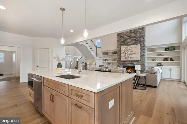 a bathroom with a granite countertop sink and cabinets