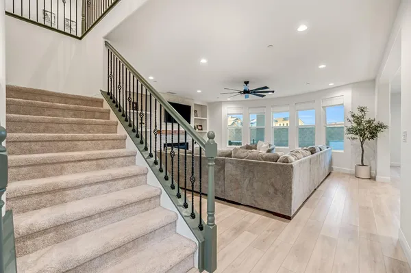 a view of an entryway and hall with wooden floor