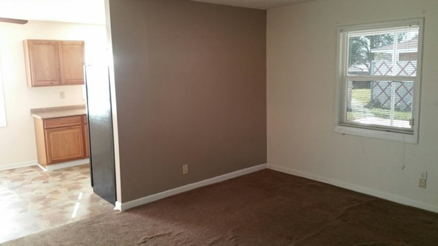 1624 Randall Road, Unit 607 Macon, GA 31206 - Photo 7 of 11 an empty room with windows and closet