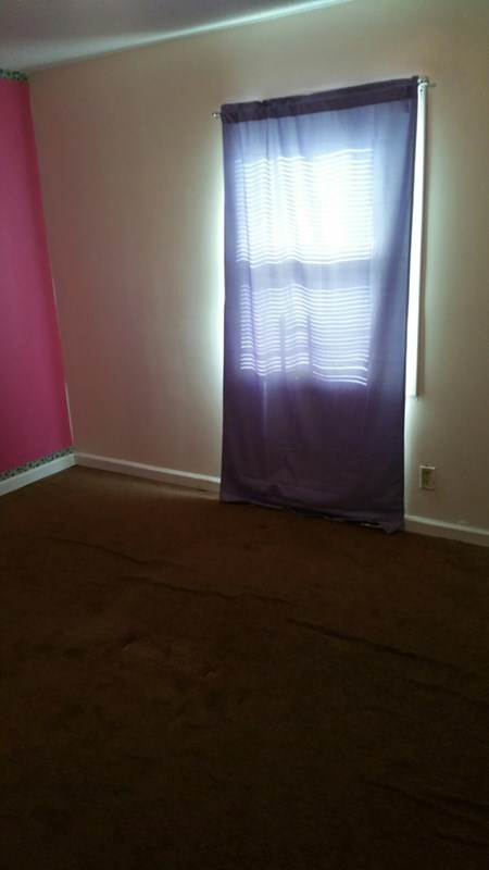 1624 Randall Road, Unit 607 Macon, GA 31206 - Photo 10 of 11 a view of empty room with window