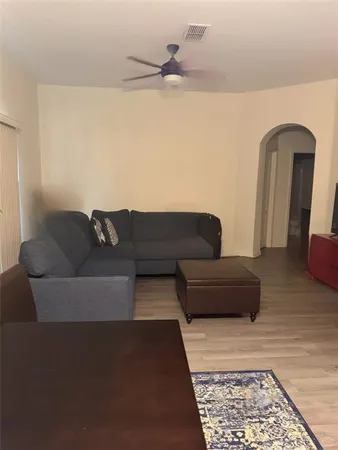 a living room with furniture and a rug