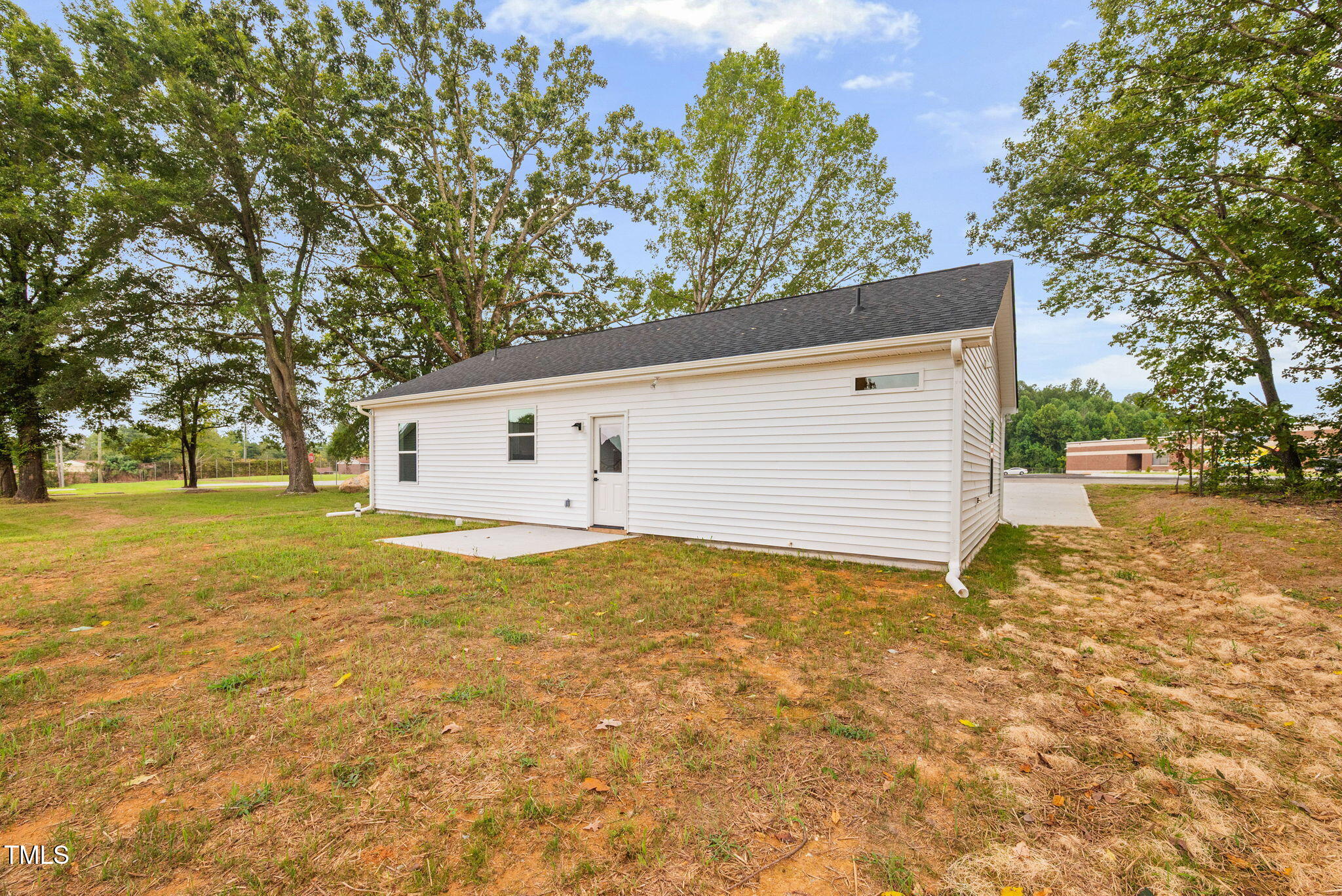 156 Southern Middle School Road Roxboro, NC 27573 - Photo 28 of 32 a view of a house with backyard and tree