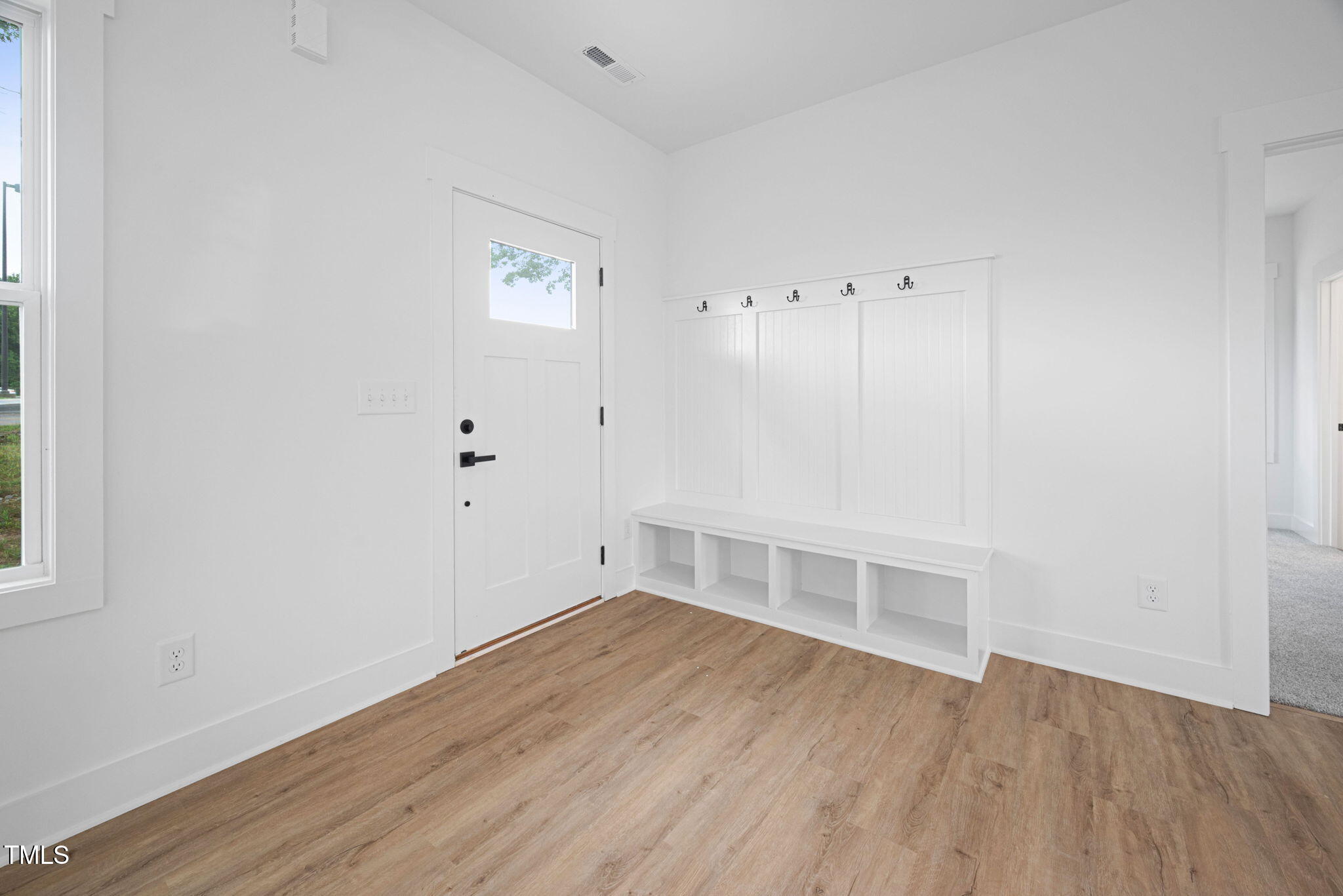 156 Southern Middle School Road Roxboro, NC 27573 - Photo 6 of 32 an empty room with wooden floor