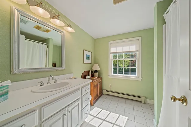a bedroom with furniture and white walls