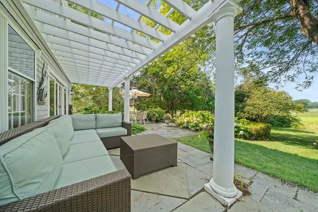 an aerial view of ocean with residential house with outdoor space