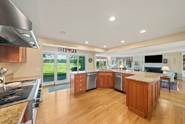 a kitchen with stainless steel appliances granite countertop a stove and a refrigerator