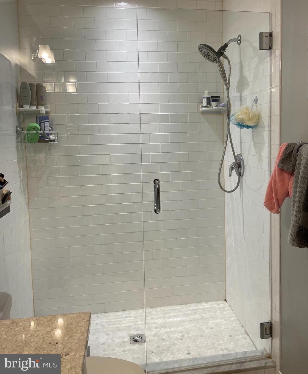 2928 Keswick Road Baltimore, MD 21211 - Photo 19 of 29 Tiled shower w/thick glass door in primary bath