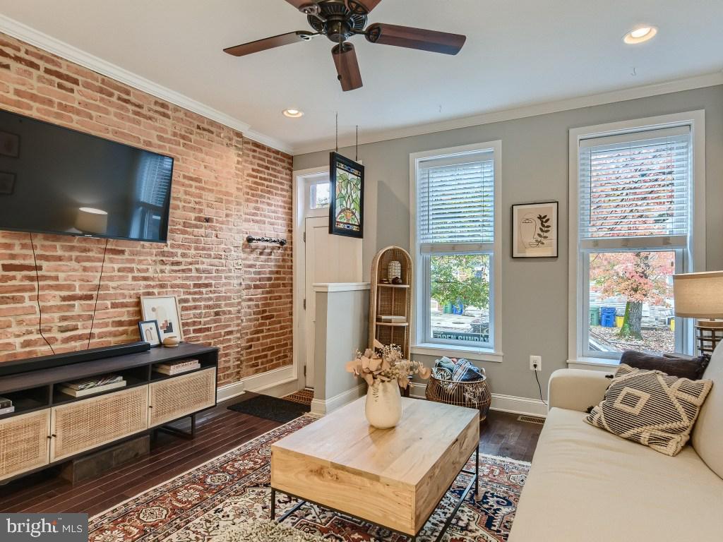 2928 Keswick Road Baltimore, MD 21211 - Photo 2 of 29 Living room w/exposed brick wall