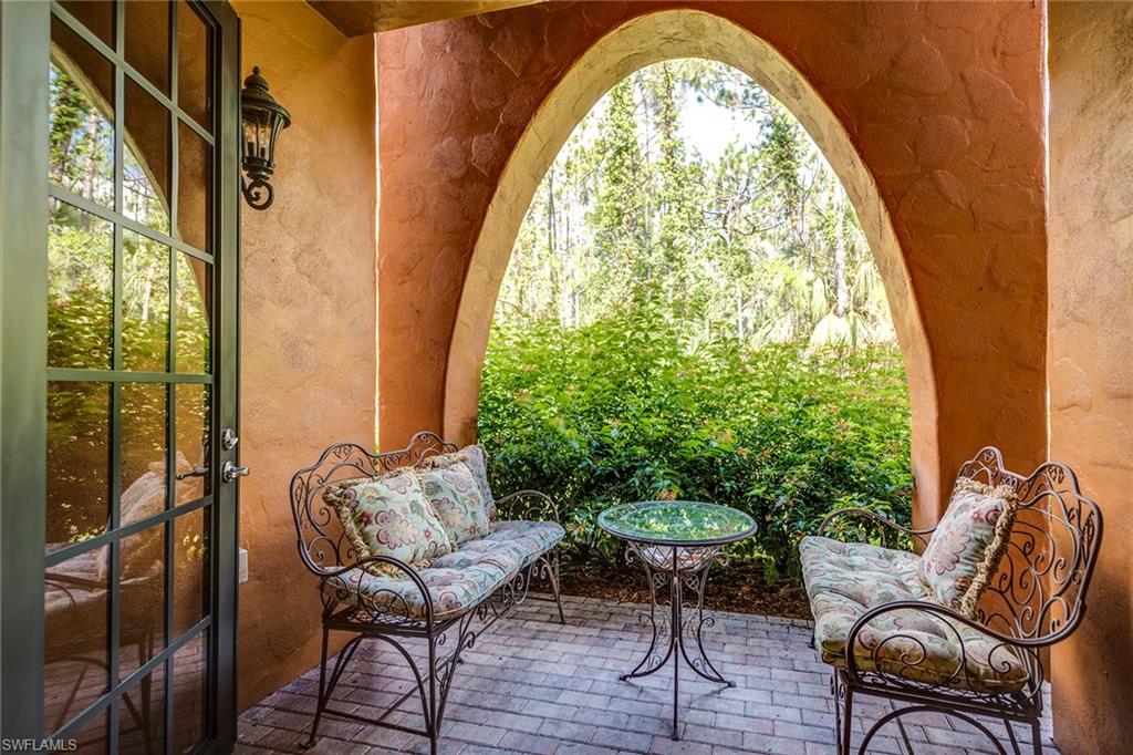 9161 Chula Vista Street, Unit 1352 Naples, FL 34113 - Photo 11 of 23 a view of balcony with furniture