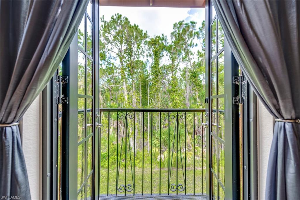 9161 Chula Vista Street, Unit 1352 Naples, FL 34113 - Photo 14 of 23 a view of a garden from stairs