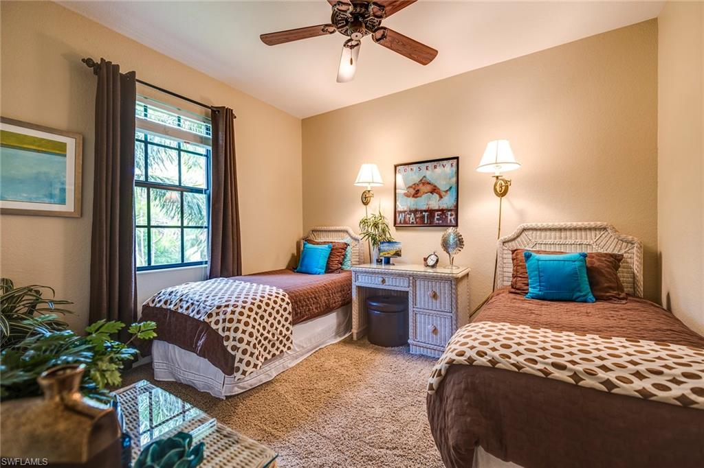 9161 Chula Vista Street, Unit 1352 Naples, FL 34113 - Photo 19 of 23 a bedroom with a large bed and a window