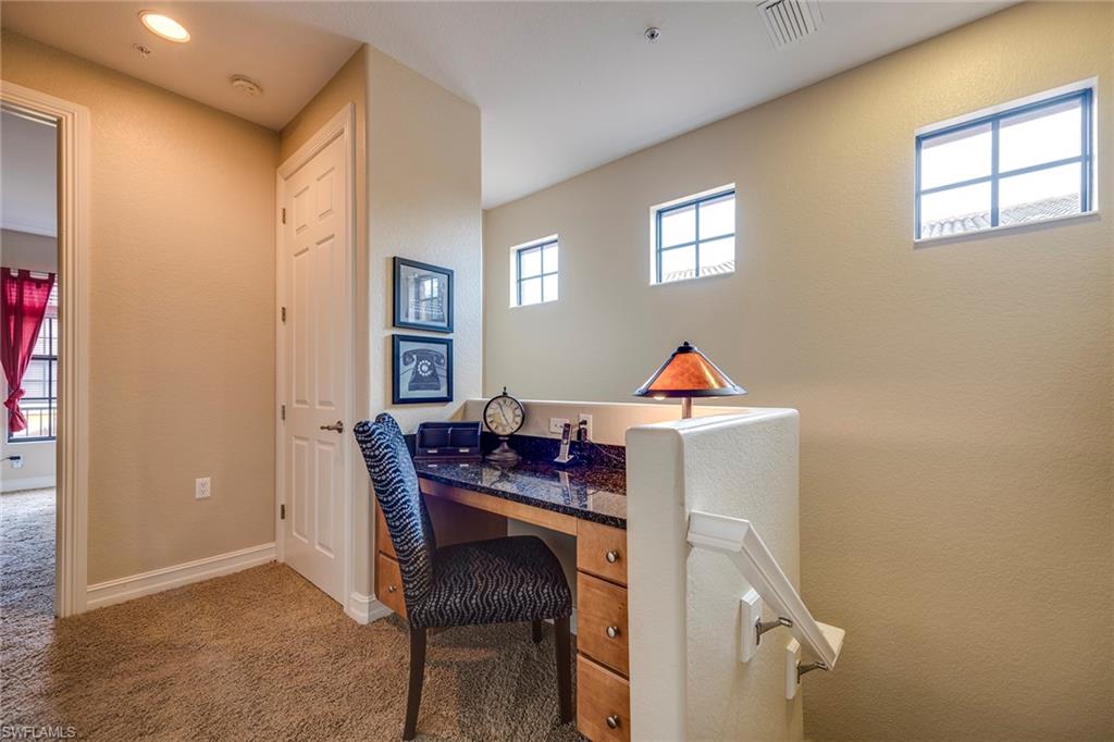 9161 Chula Vista Street, Unit 1352 Naples, FL 34113 - Photo 22 of 23 a workspace with furniture and window
