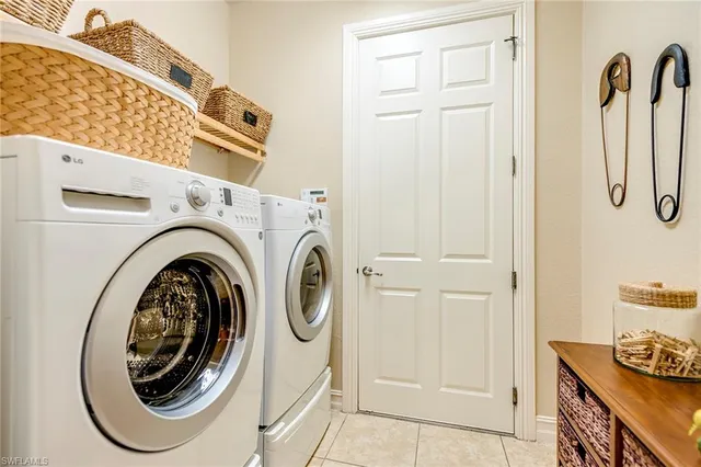 a view of a storage & utility room with washer and dryer