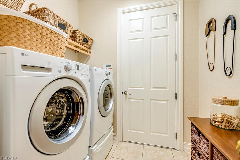 9161 Chula Vista Street, Unit 1352 Naples, FL 34113 - Photo 23 of 23 a view of a storage & utility room with washer and dryer
