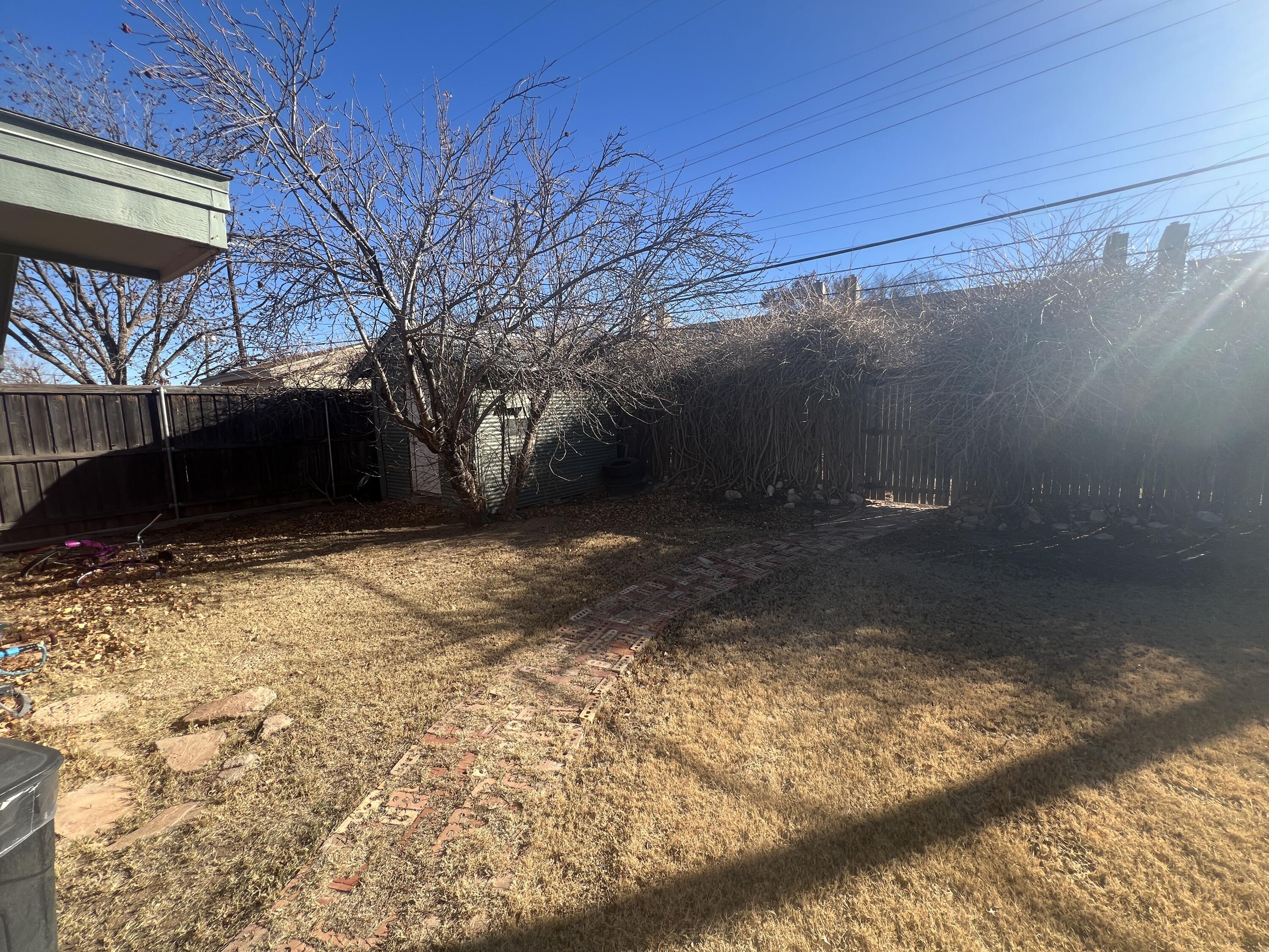 5227 9th Street Lubbock, TX 79416 - Photo 14 of 16 Back to Fence w_ Shed